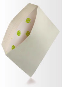 Homemade envelope with four leafed clover pattern inside